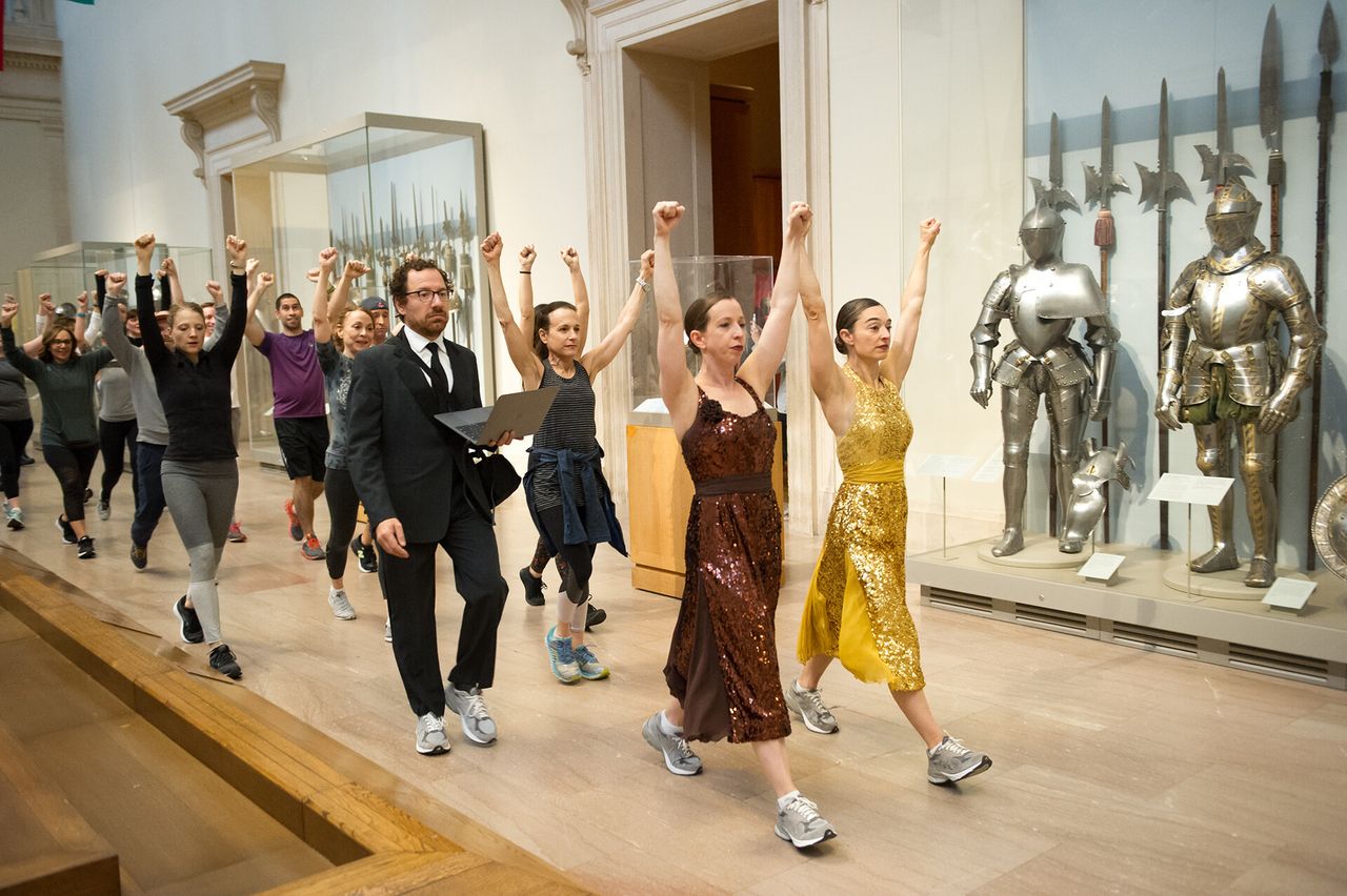 Dancers walking through the Metropolitan Museum of Art