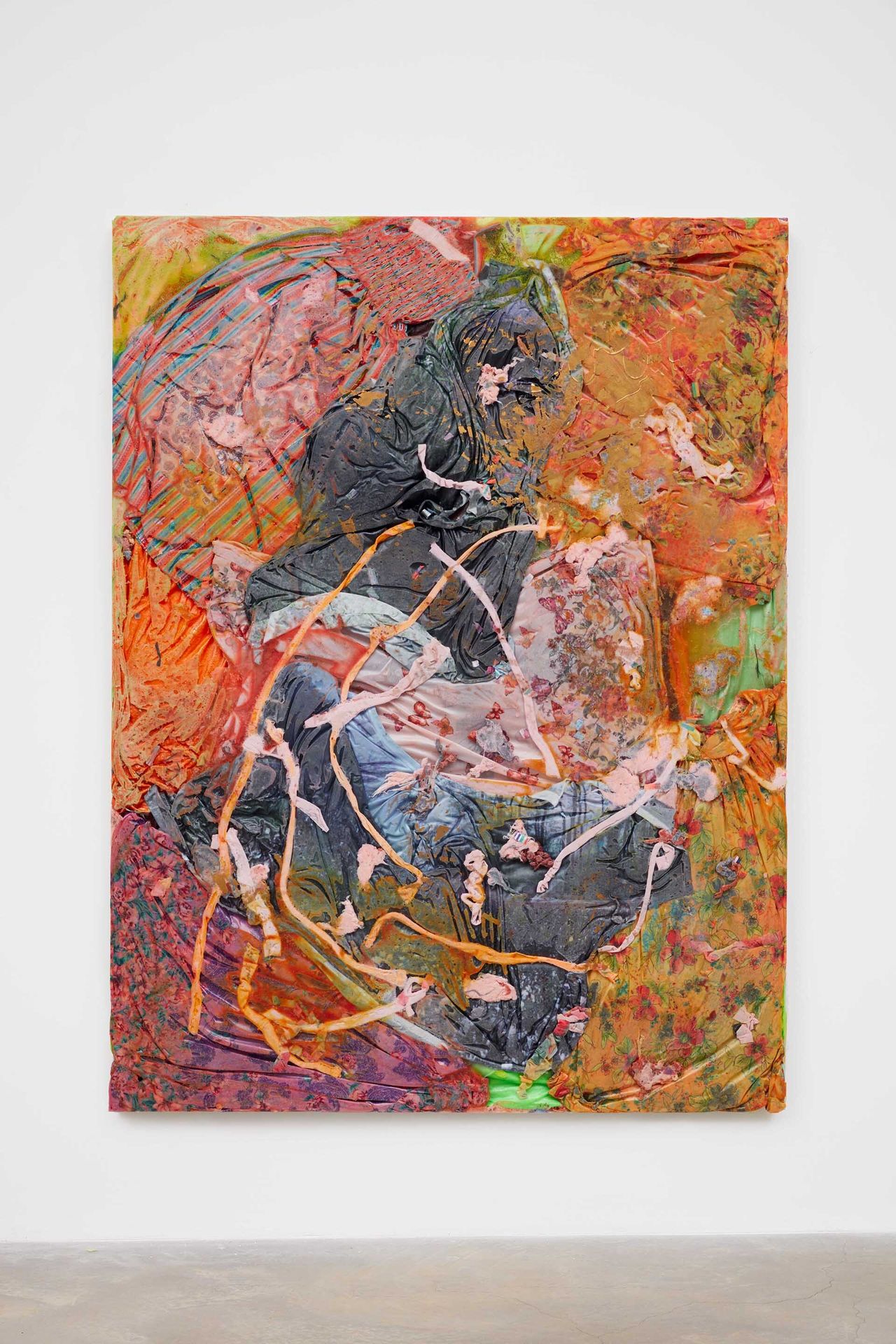 A flat, large sculpture made from resin and clothing