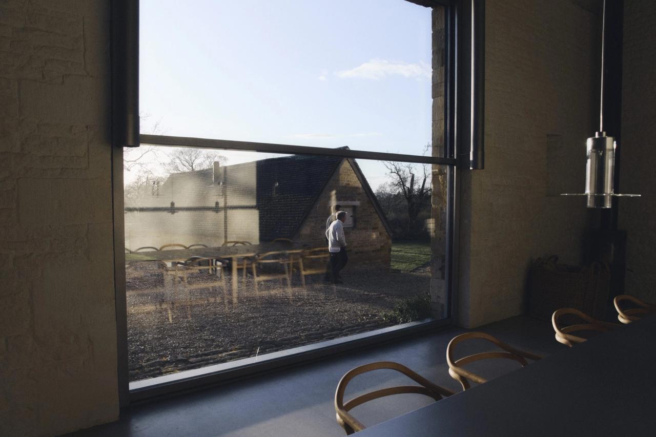 Pawson walking outside at his Home Farm in Oxfordshire, photographed during his interview for this episode of Time Sensitive. (Photo: Suzie Howell for The Slowdown)