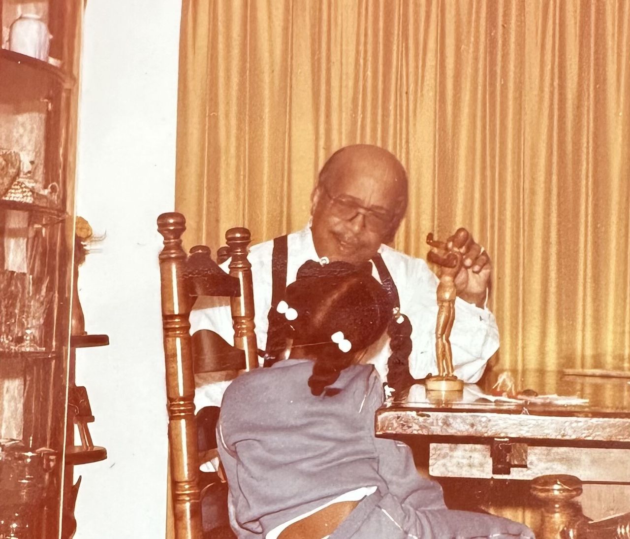 Lewis as a child with her grandfather. (Courtesy Sarah Lewis)