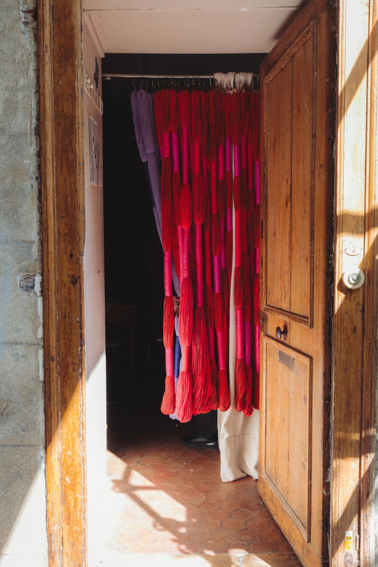 A curtain of threads hanging at the entrance to Hicks’s studio in Paris. (Photo: Agathe Karsenti for The Slowdown)