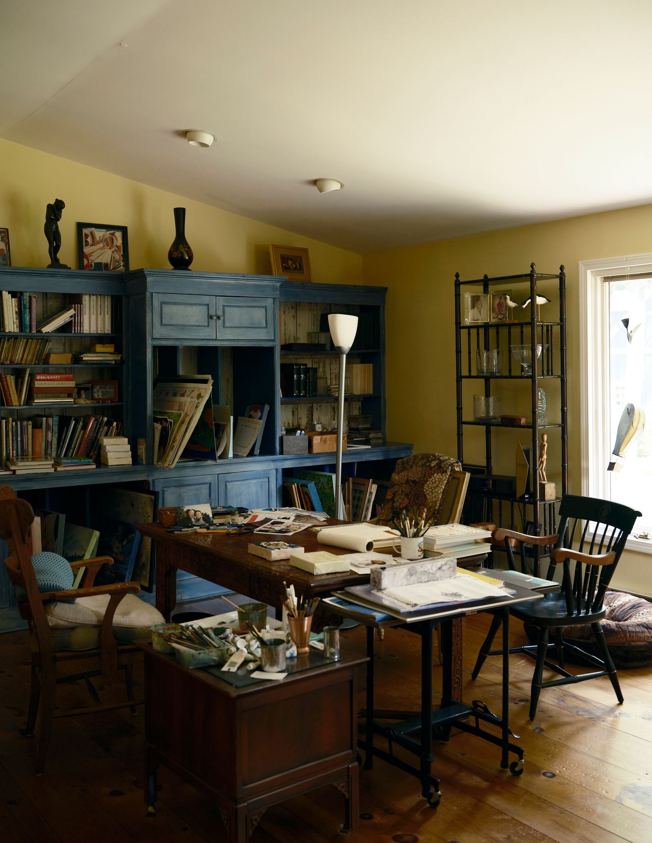 Pépin’s office, filled with books and painting supplies, at his home in Connecticut. (Photo: Matthew Harrington for The Slowdown)