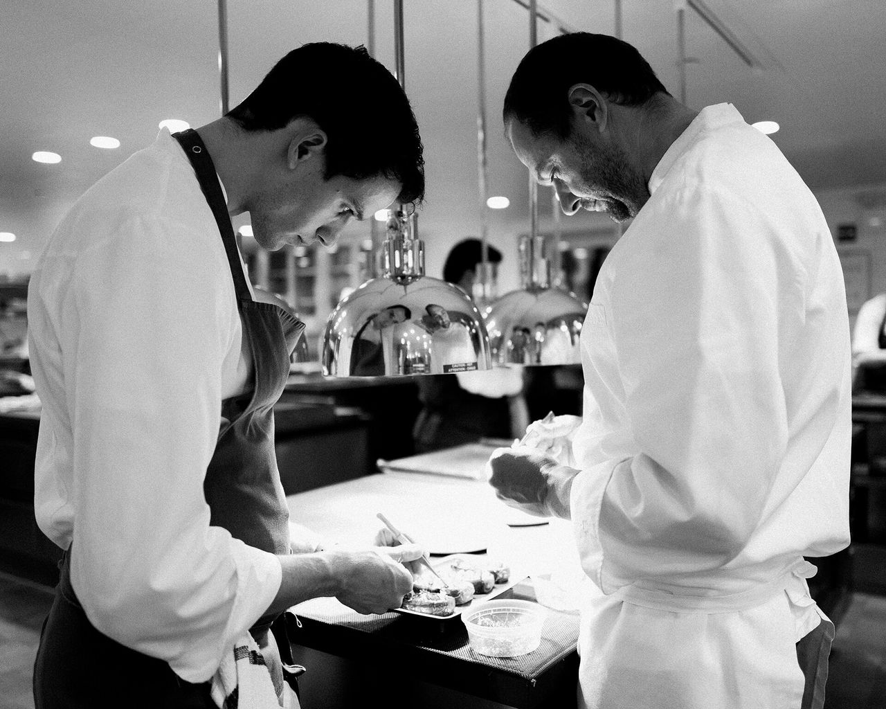 Humm with a team member at Eleven Madison Park. (Courtesy Daniel Humm)