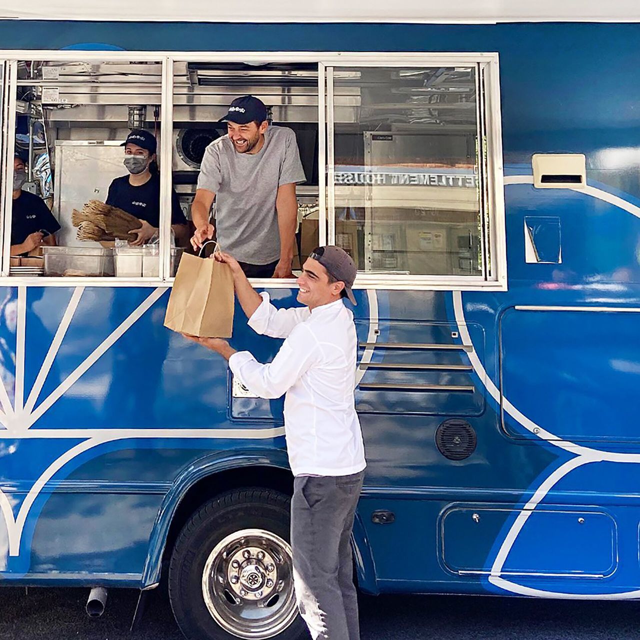 Humm and his team serving meals out of their food truck at the Queensbridge Housing Project. (Courtesy Daniel Humm)