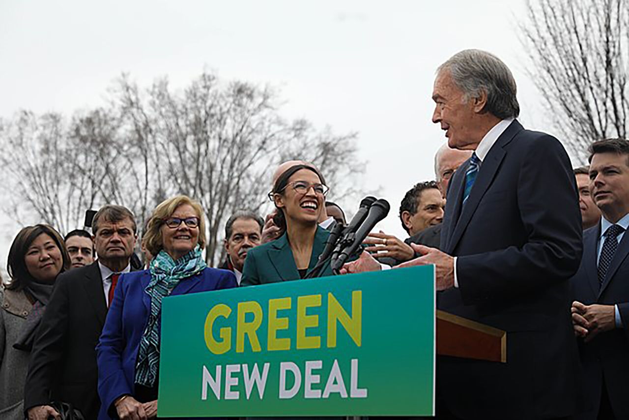Representative Alexandria Ocasio-Cortez (center) speaks on the Green New Deal with Senator Ed Markey (right) in front of the Capitol Building in February 2019. (Courtesy Senate Democrats)