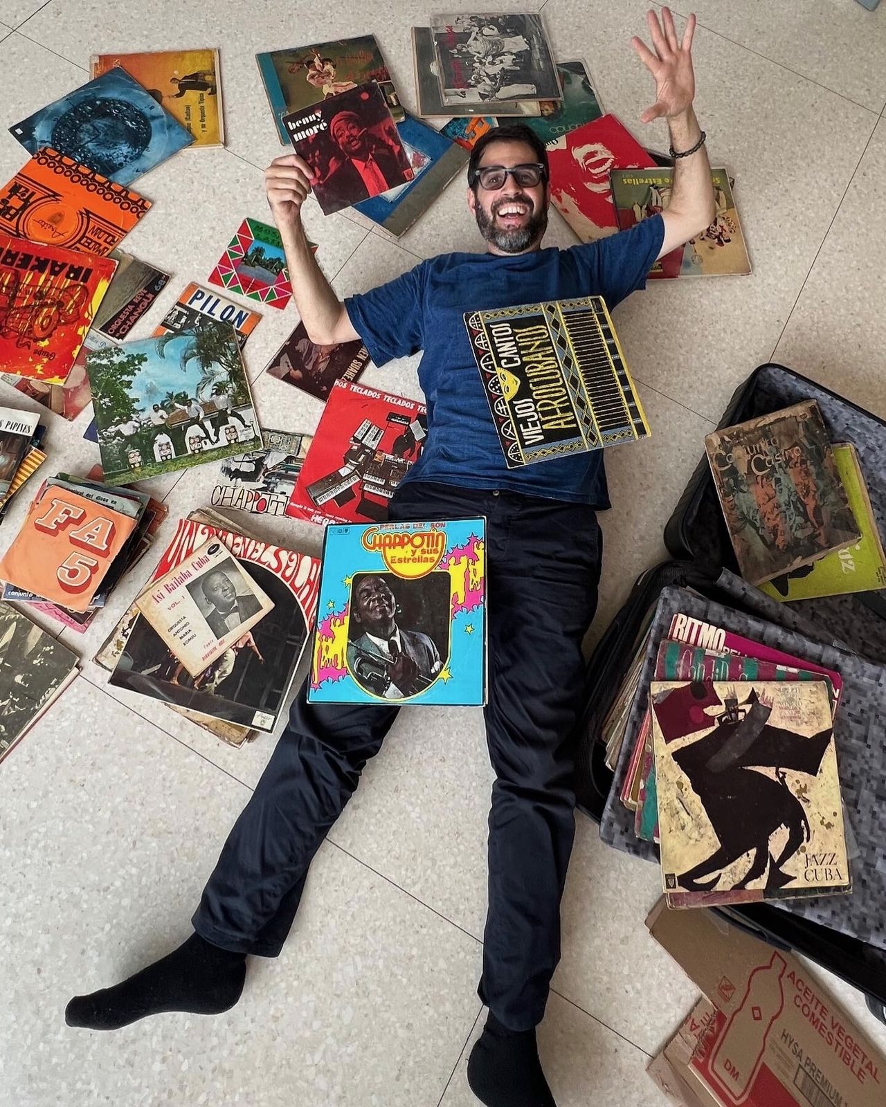 Parlá pictured with his record collection. (Courtesy José Parlá)