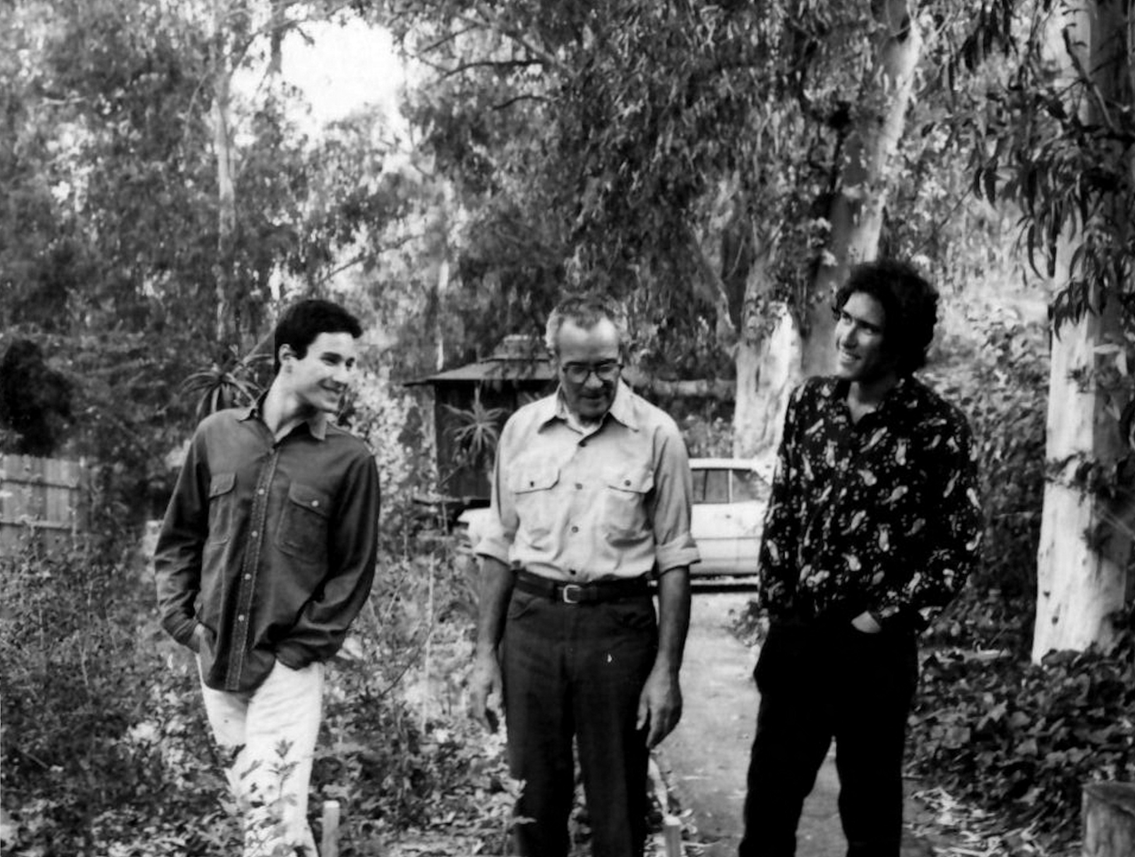 Koren at 25 with his brother (left) and father (center), with Koren’s teahouse in the background. (Courtesy Leonard Koren)