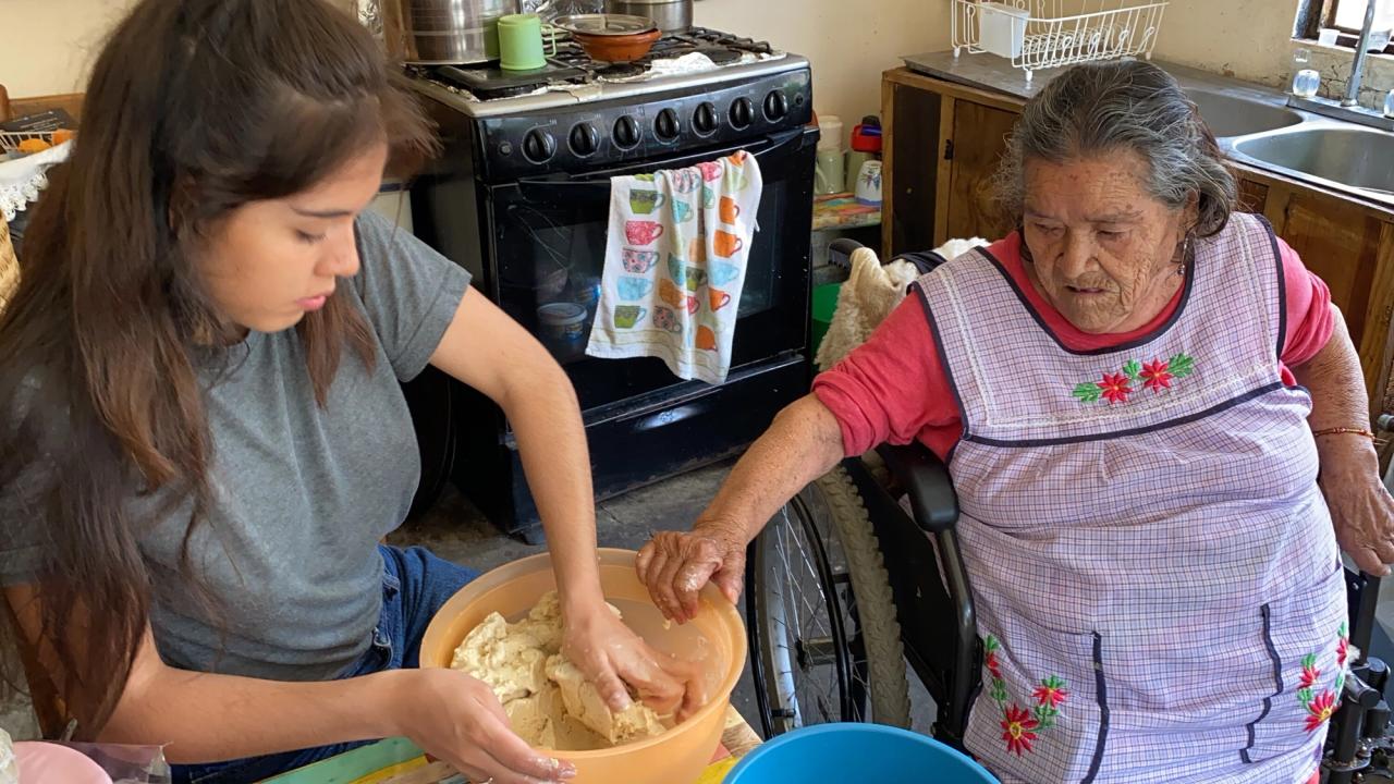 Bastida cooking with her grandmother. (Courtesy Xiye Bastida)