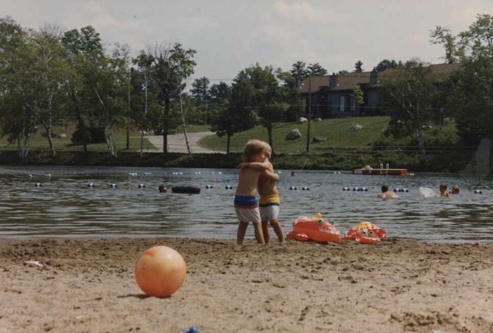 Trent and Spencer at age 4, hugging.