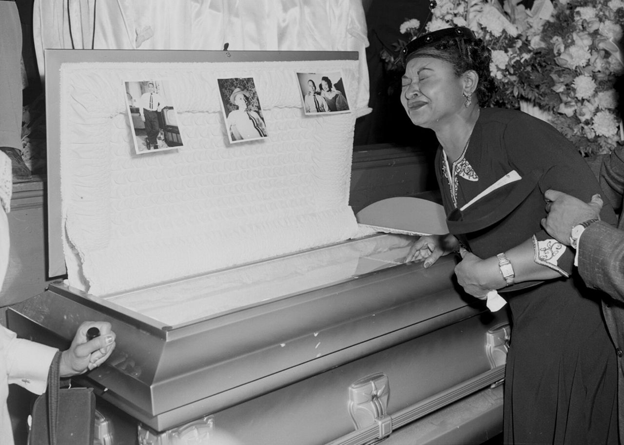 Mamie Mobley, Emmett Till's mother, at her son's casket at a Chicago funeral home.