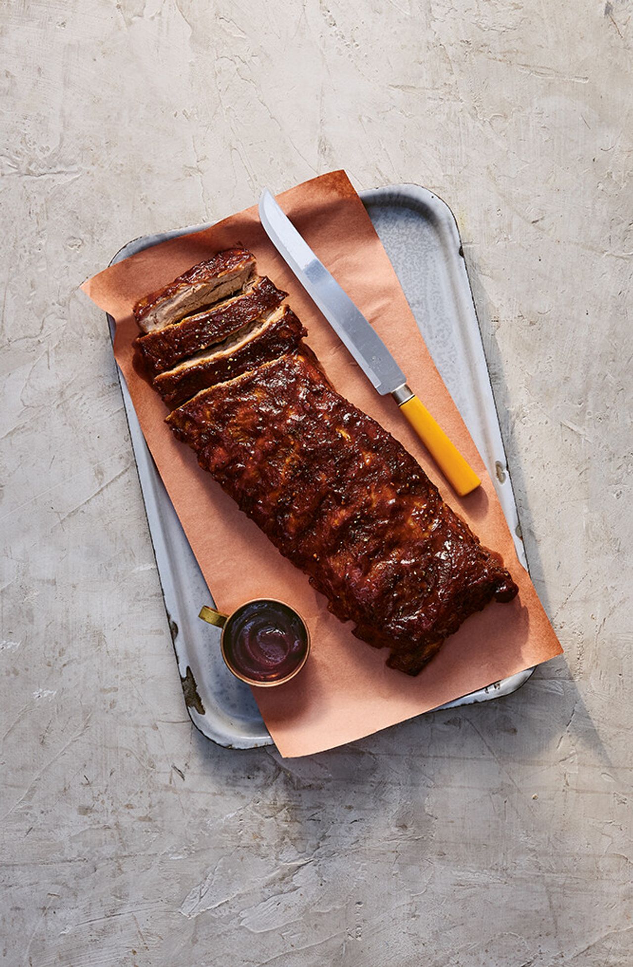Oven-baked spareribs from Recipes From the American South. (Photo: Nico Schinco/Courtesy Phaidon)