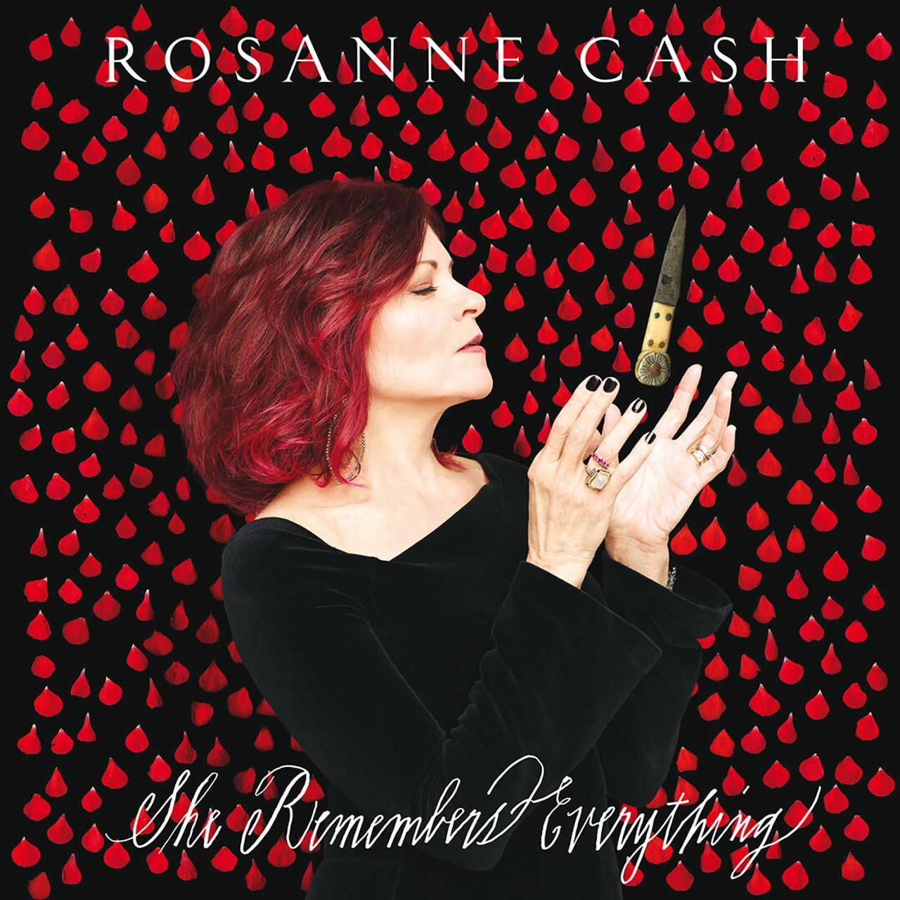 Album cover featuring singer-songwriter Rosanne Cash with a backdrop of rose petals