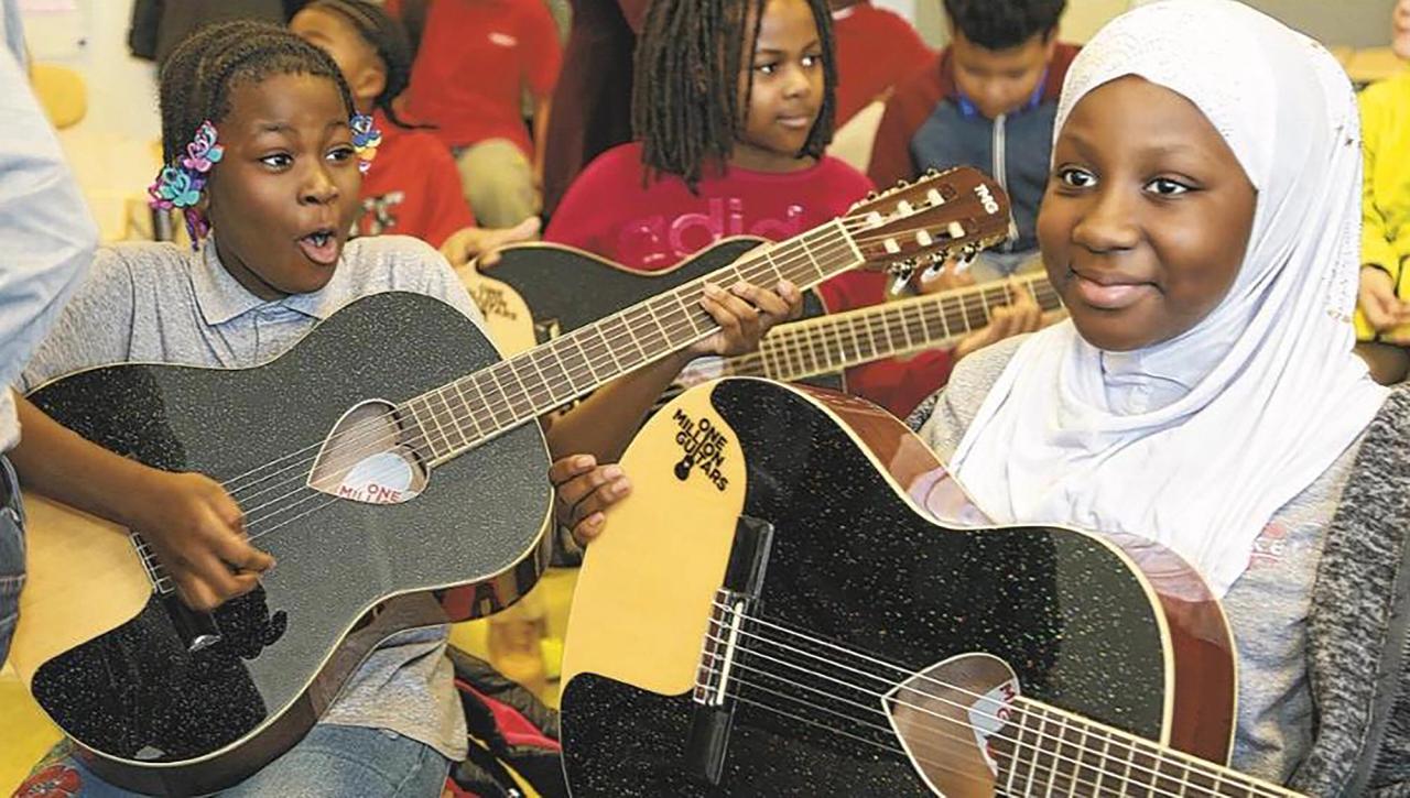 Children who received guitars as part of the One Million Guitars project. (Courtesy David Broza)