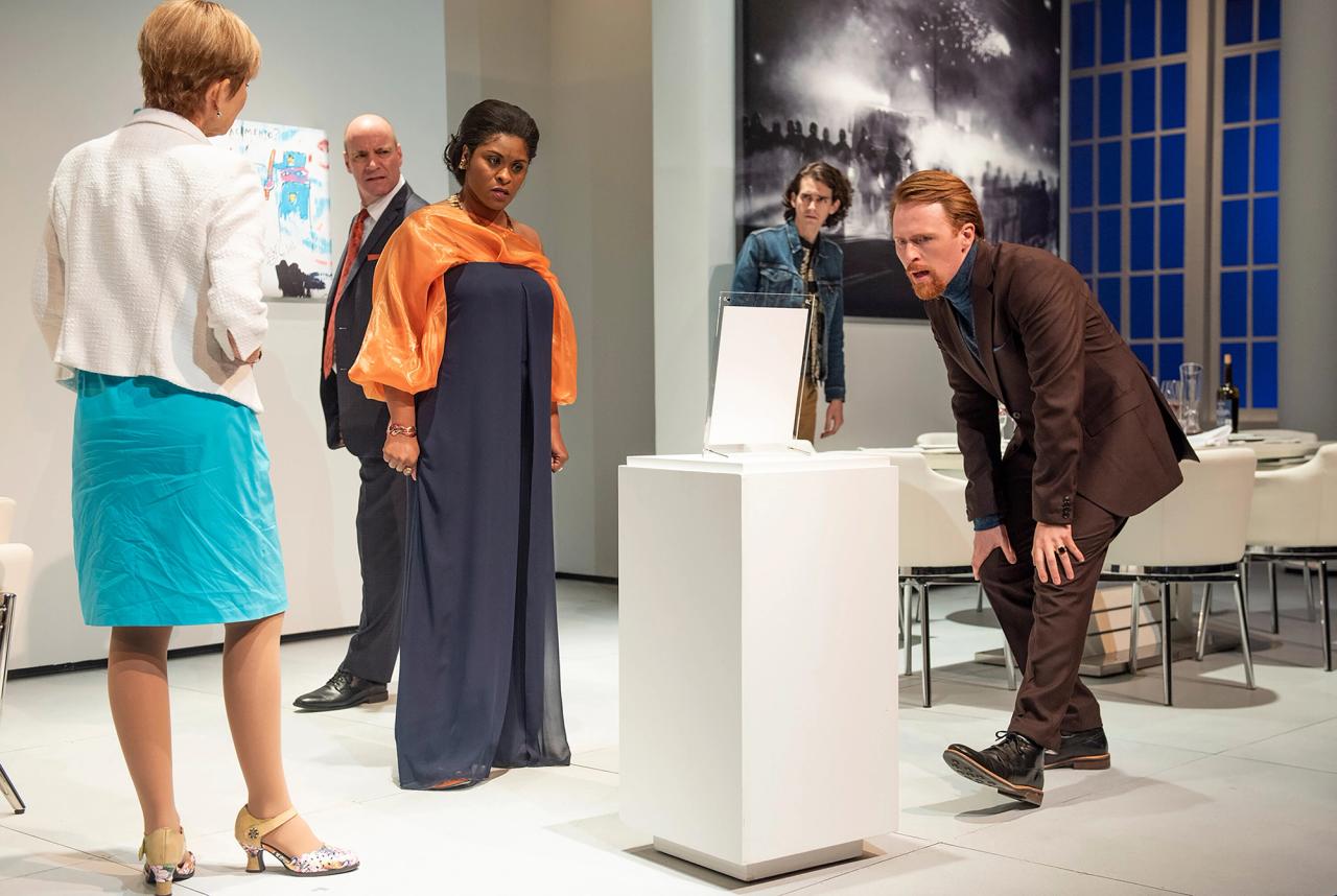 A scene from Rankine’s play The White Card. Actors from left to right: Barbara Sloan, Tom Wahl, Rita Cole, Joshua Hernandez, and Iain Batchelor. (Photo: Magnus Stark. Courtesy GableStage)