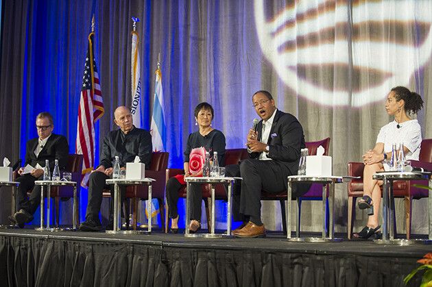 Tod Williams, Billie Tsien, and others on a stage giving a panel discussion