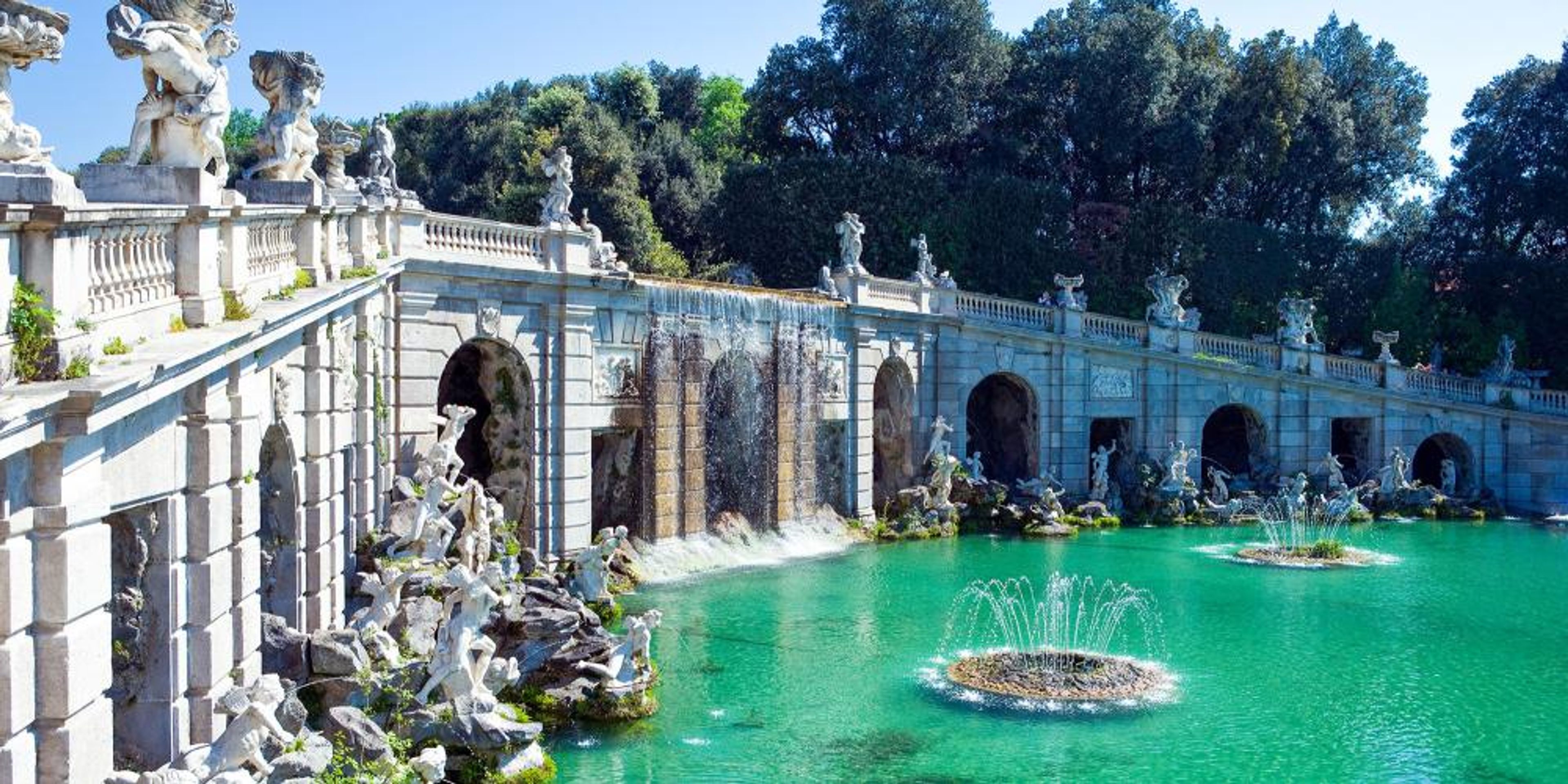 there is a fountain in the middle of the lake .