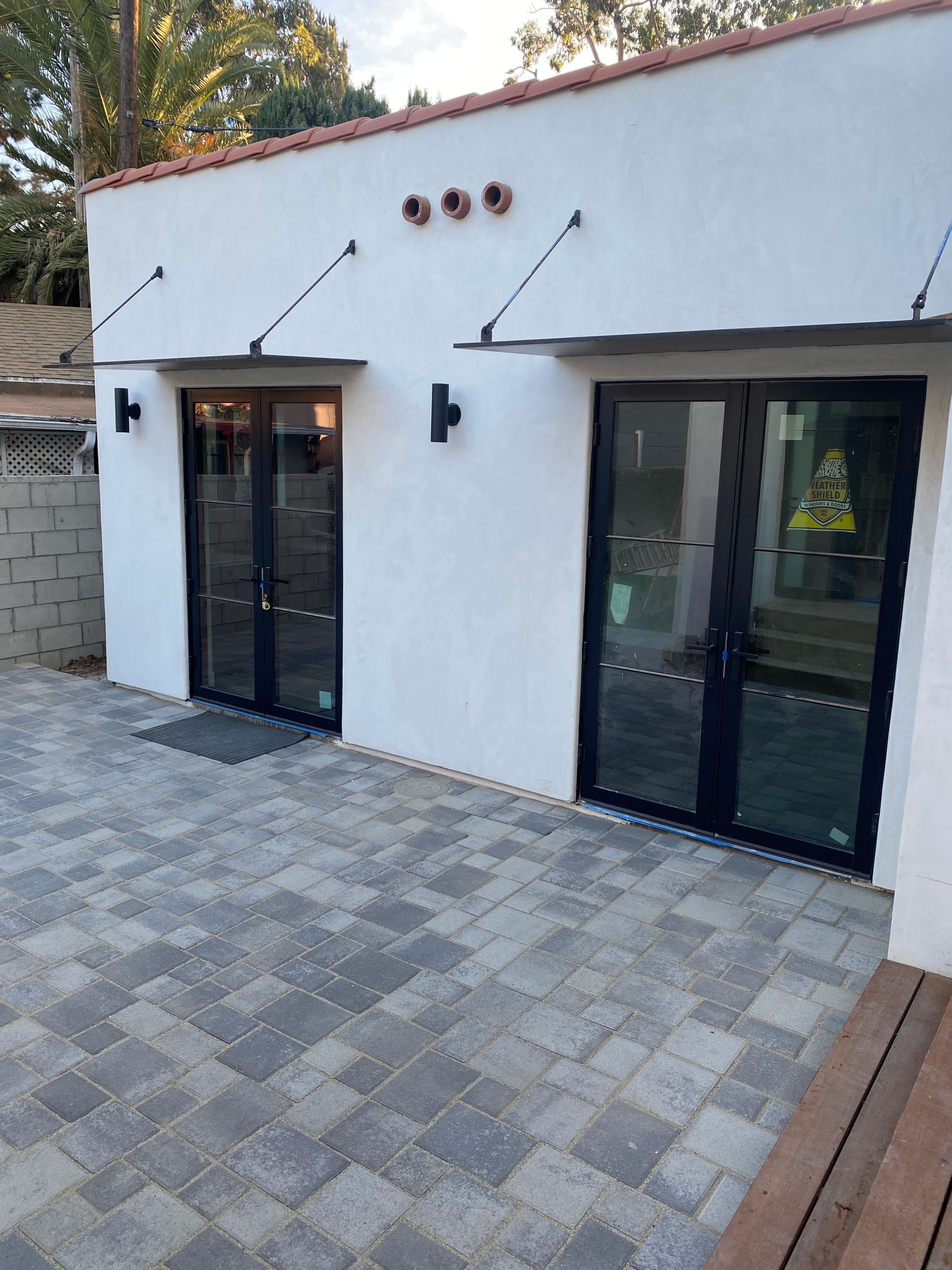 ADU entryways with thin metal awning