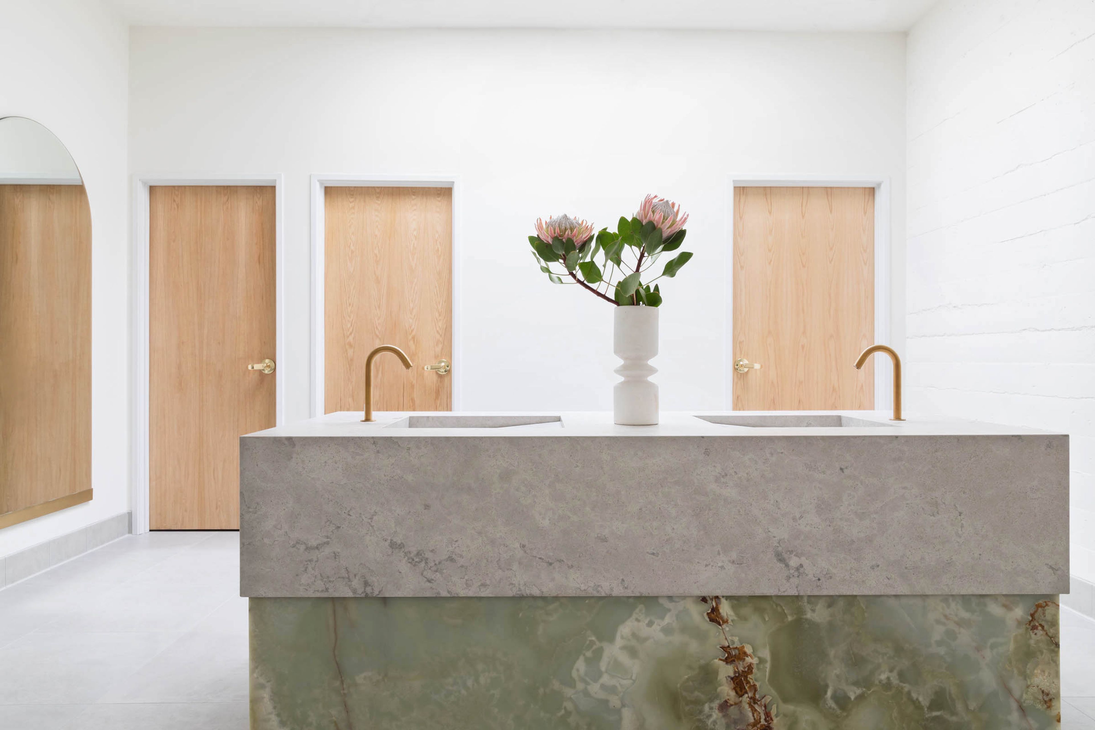 Custom onyx and limestone vanity