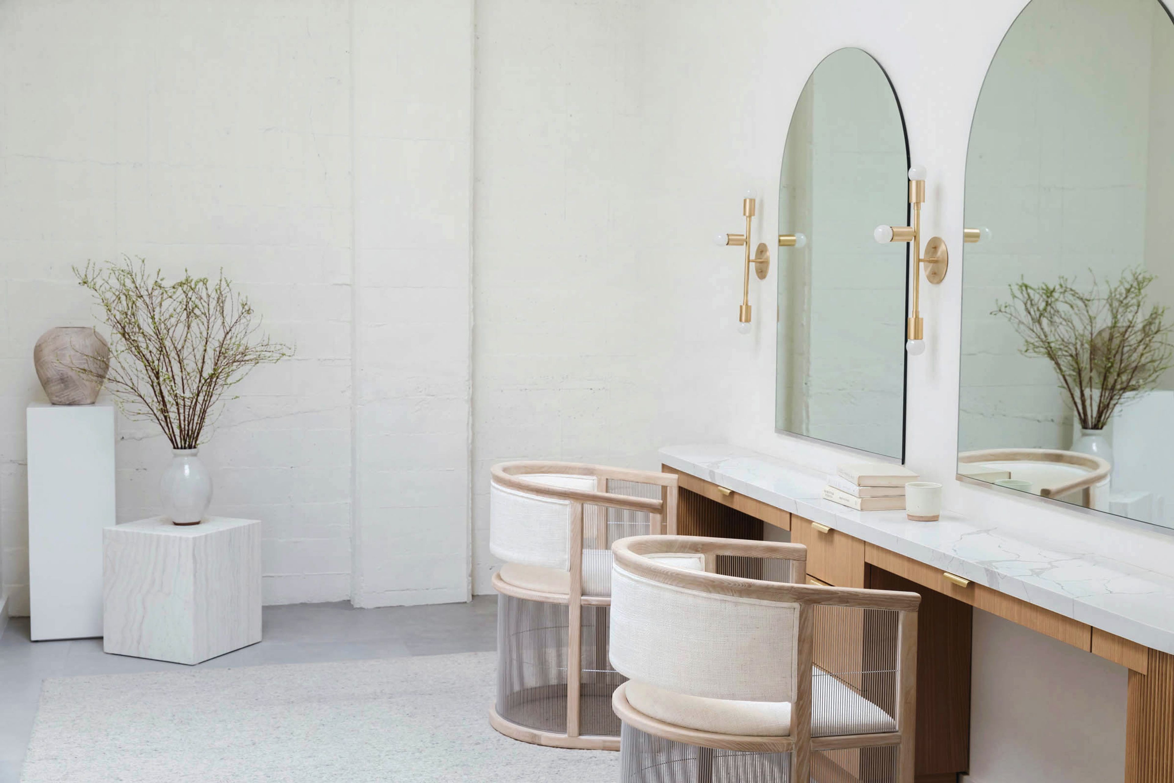 Dressing room featuring custom designed vanity and mirrors