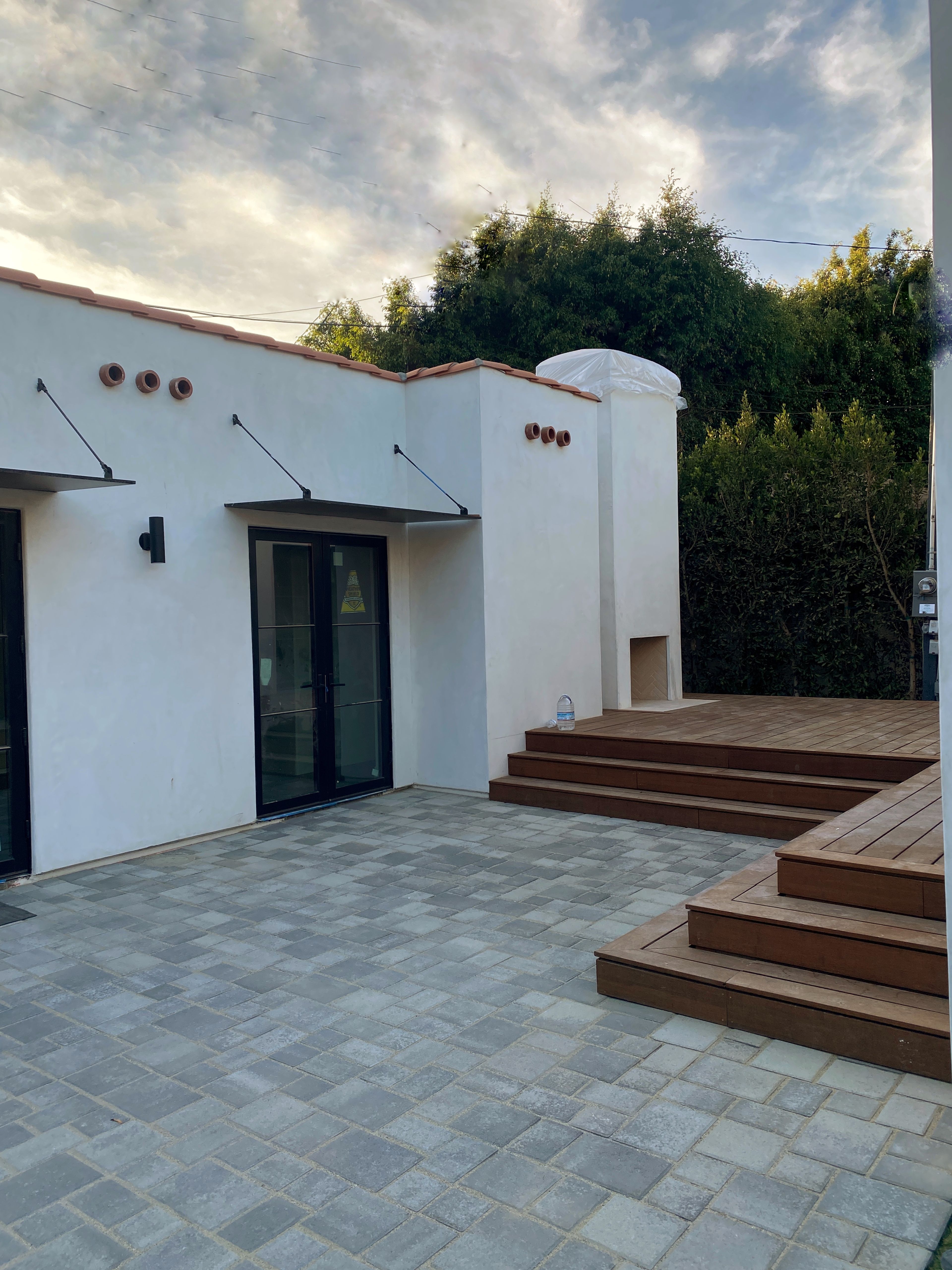 Backyard courtyard created between main house and detached guest house