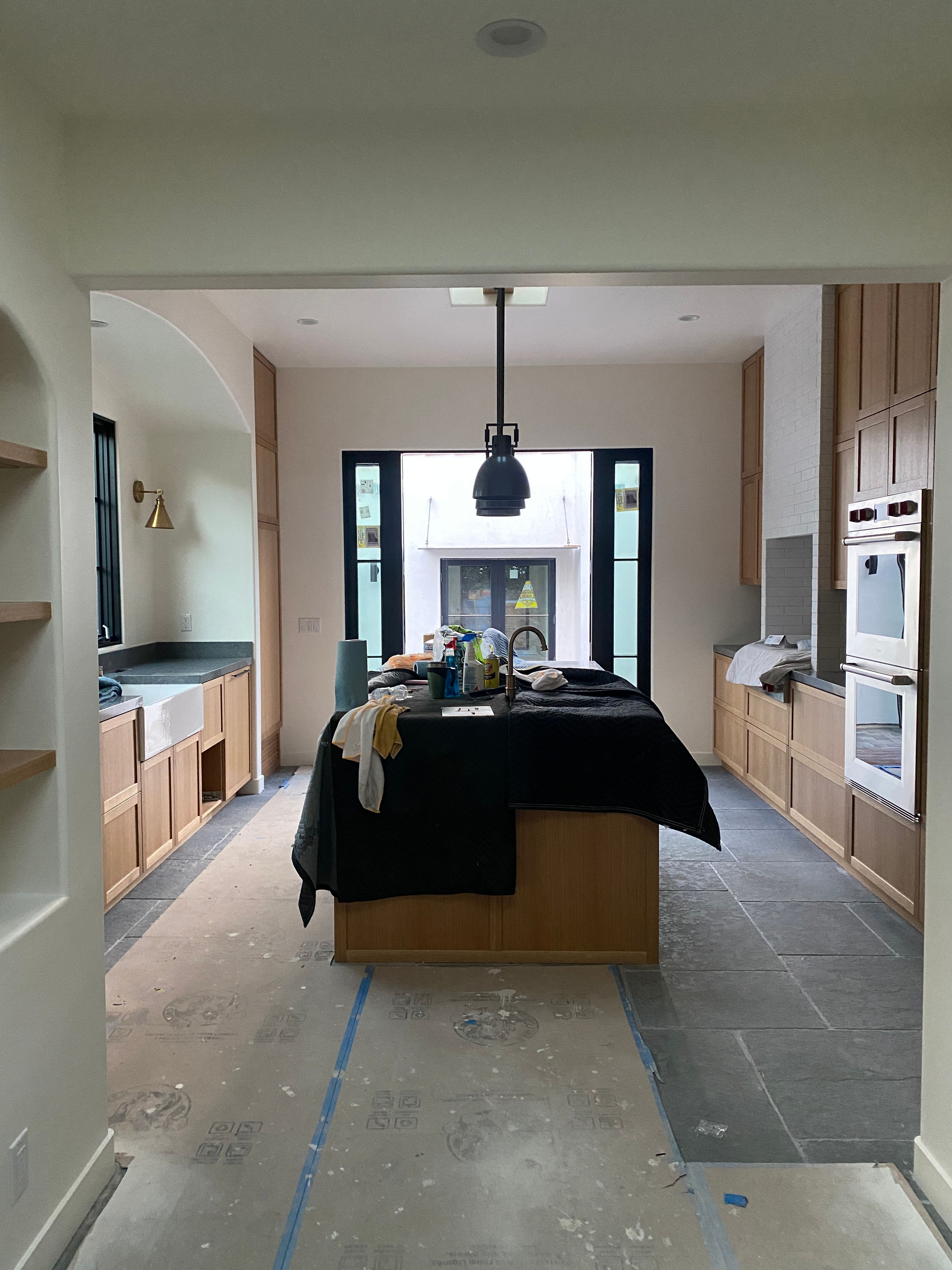 Generous light from above, a expansive window and French double doors with side lights