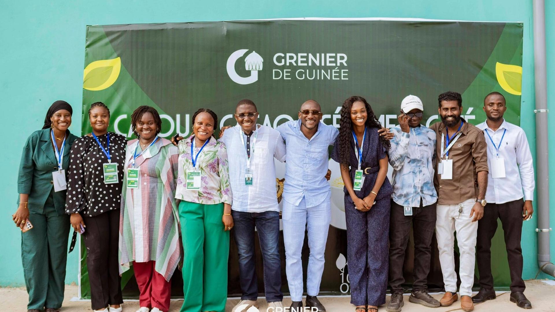 Smiling Guinean farmers carefully hand-sorting premium cashew nuts, illustrating traditional expertise, quality craftsmanship, and agricultural excellence.