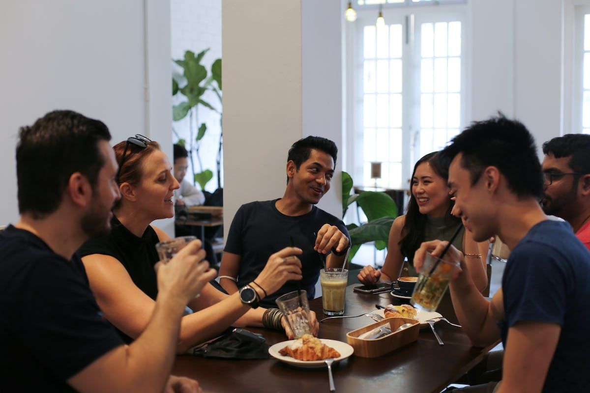A group of people at Soda participating in a huddle session