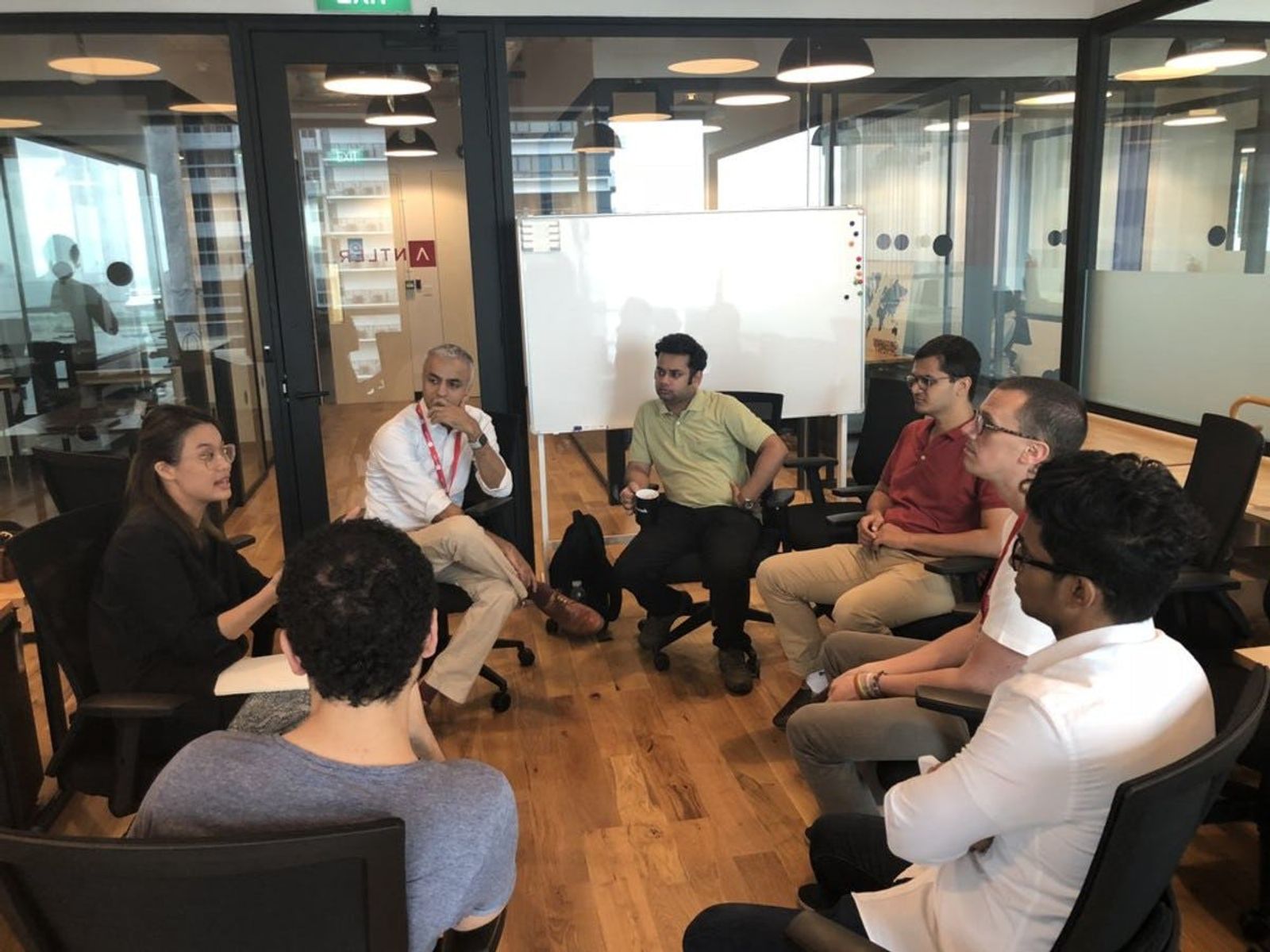 People sitting in circle having discussion for Antler Cohort 