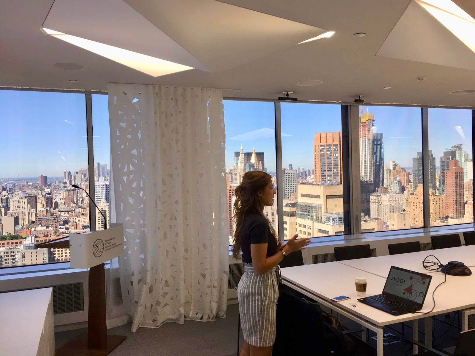 Anna Ratala Co-Founder of Zvook Practicing presentation on board room 