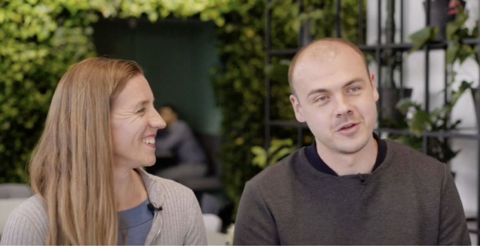 Image of RespiQ Co-Founder Mira Gleisberg smiling and Vitalii Vorkov talking