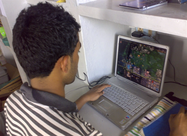 A photograph of Raijith Shaji, co-founder and CEO of Volopay as a teenager playing a computer game