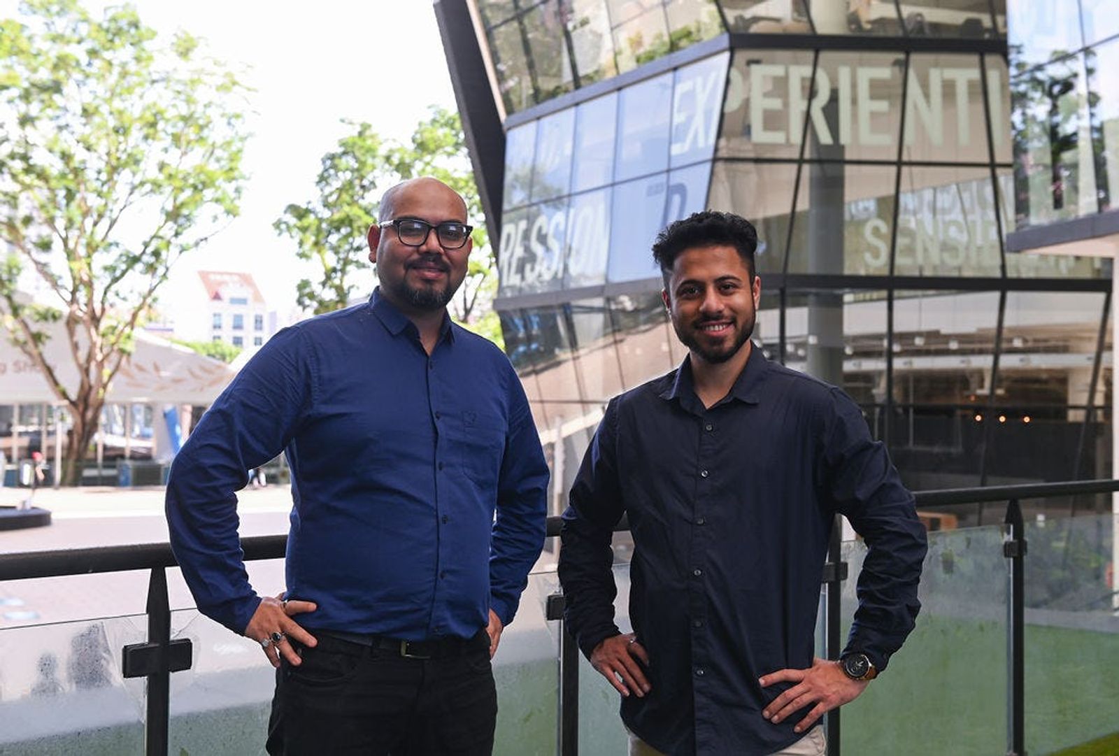 Evrcare CEO Sohail Khan CEO and CTO Gourav Goyal with hands on hips posing outside with trees in the background