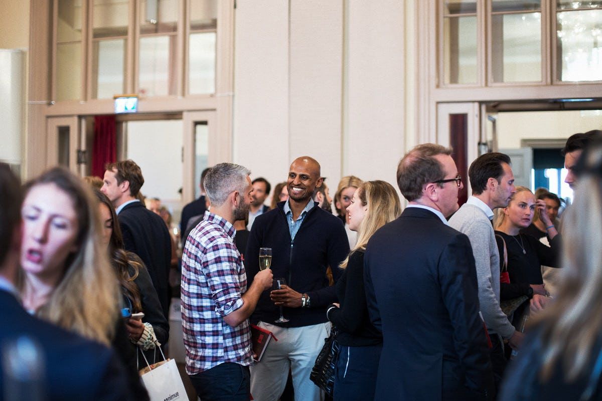 Crowd of people socialise together at Stockholm's inaugural Demo Day