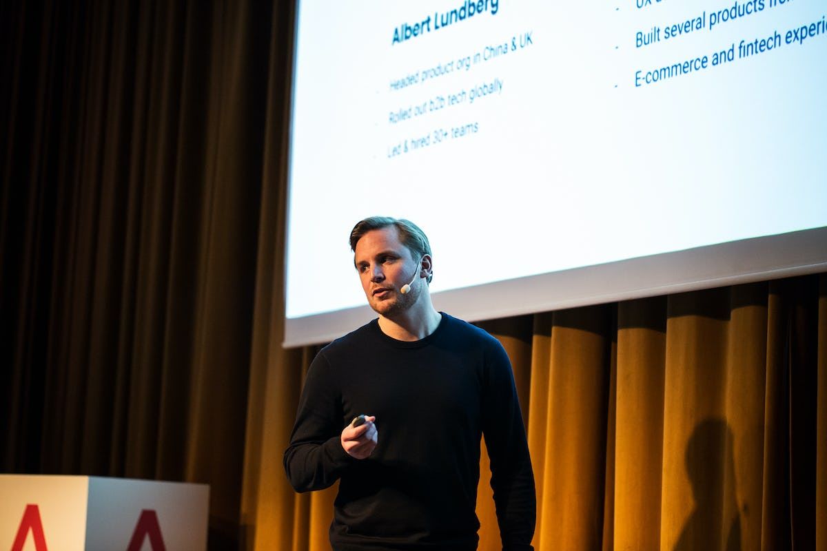 Antler representative presenting with powerpoint presentation in the background
