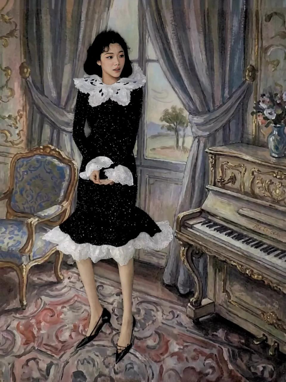 Sammi Chen standing beside a painted piano in a black-and-white dress.