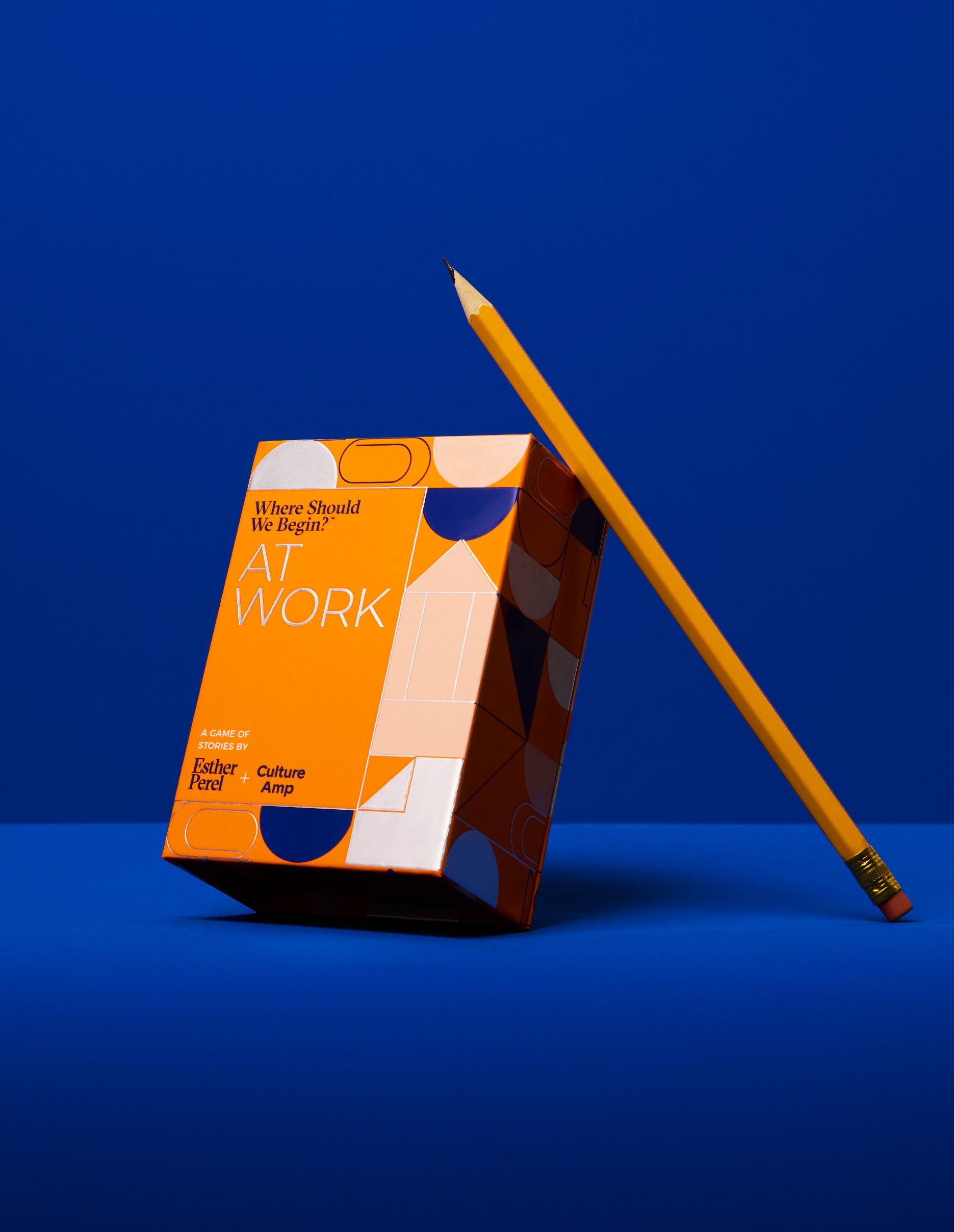 A boxed deck of the 'Where should we begin: At Work' cards, with a pencil resting on top