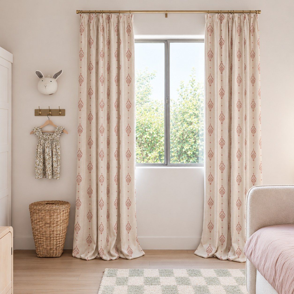 Rose damask linen textured curtains at a window in a soft pink nursery