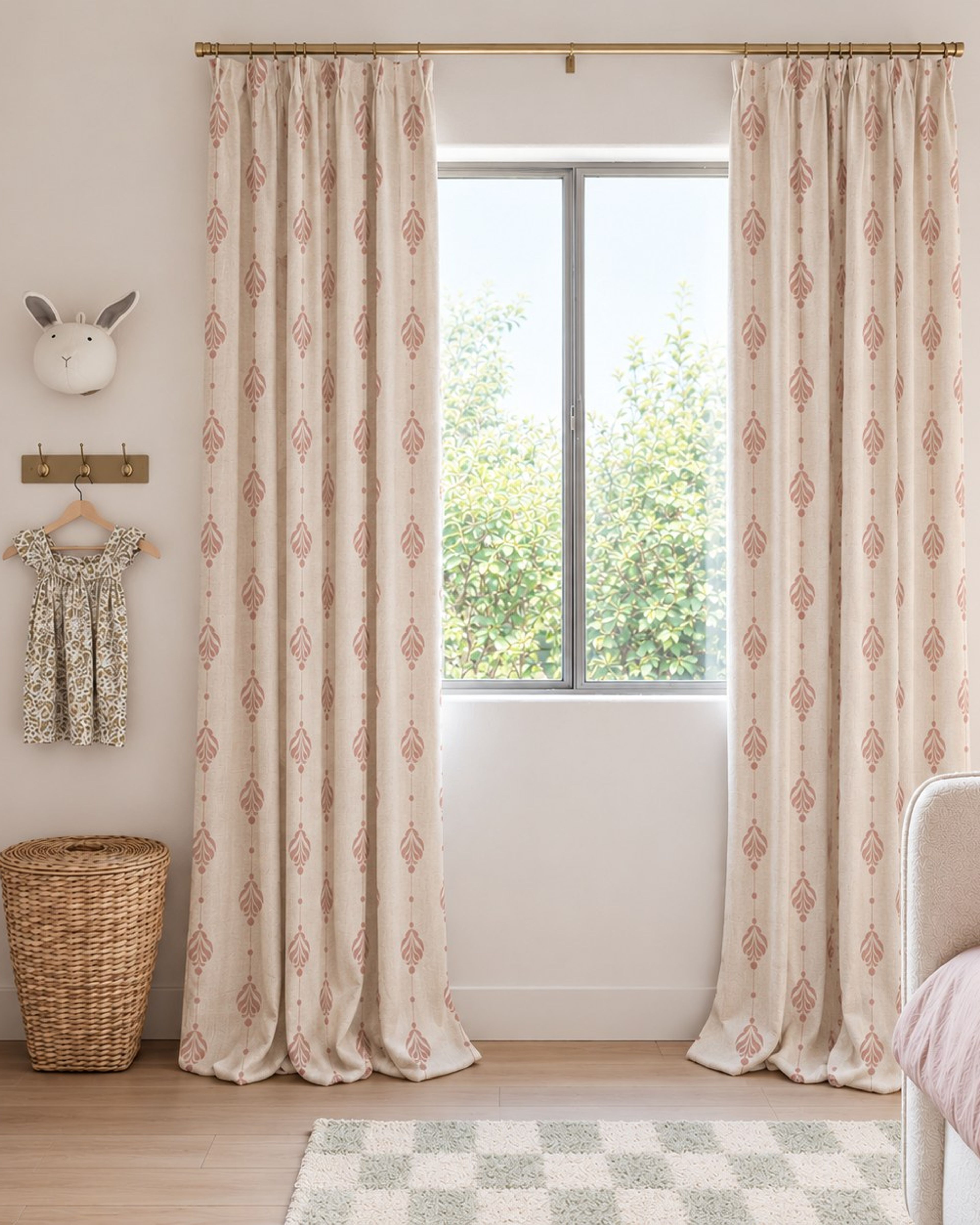 Rose damask linen textured curtains at a window in a soft pink nursery