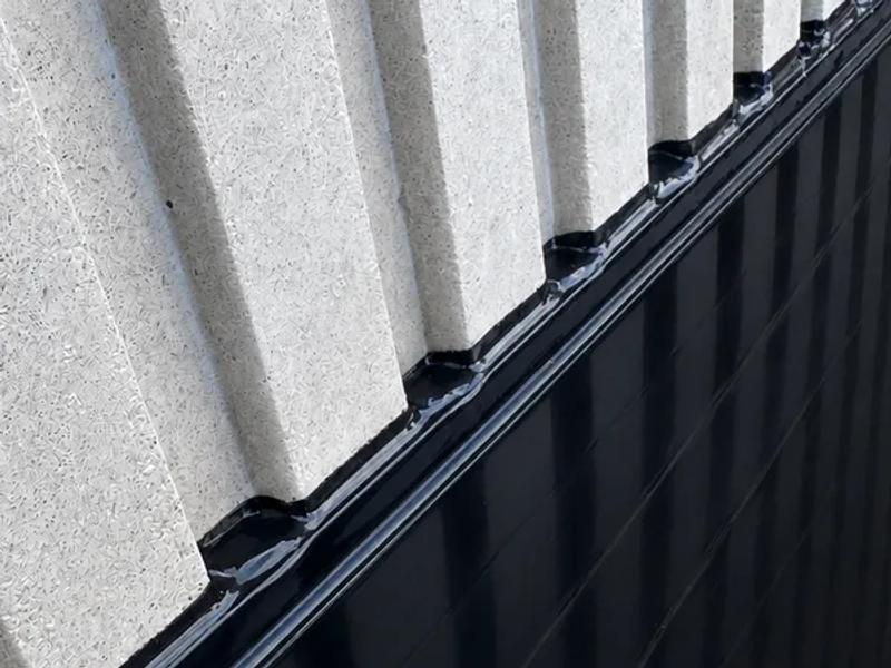 Polyurethane control joint between precast panels on a commercial facade