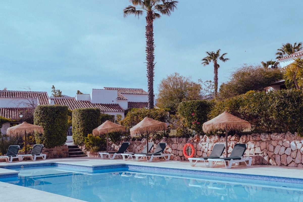 Pueblo-style cottages and pool among the gardens at Finca Cantueso