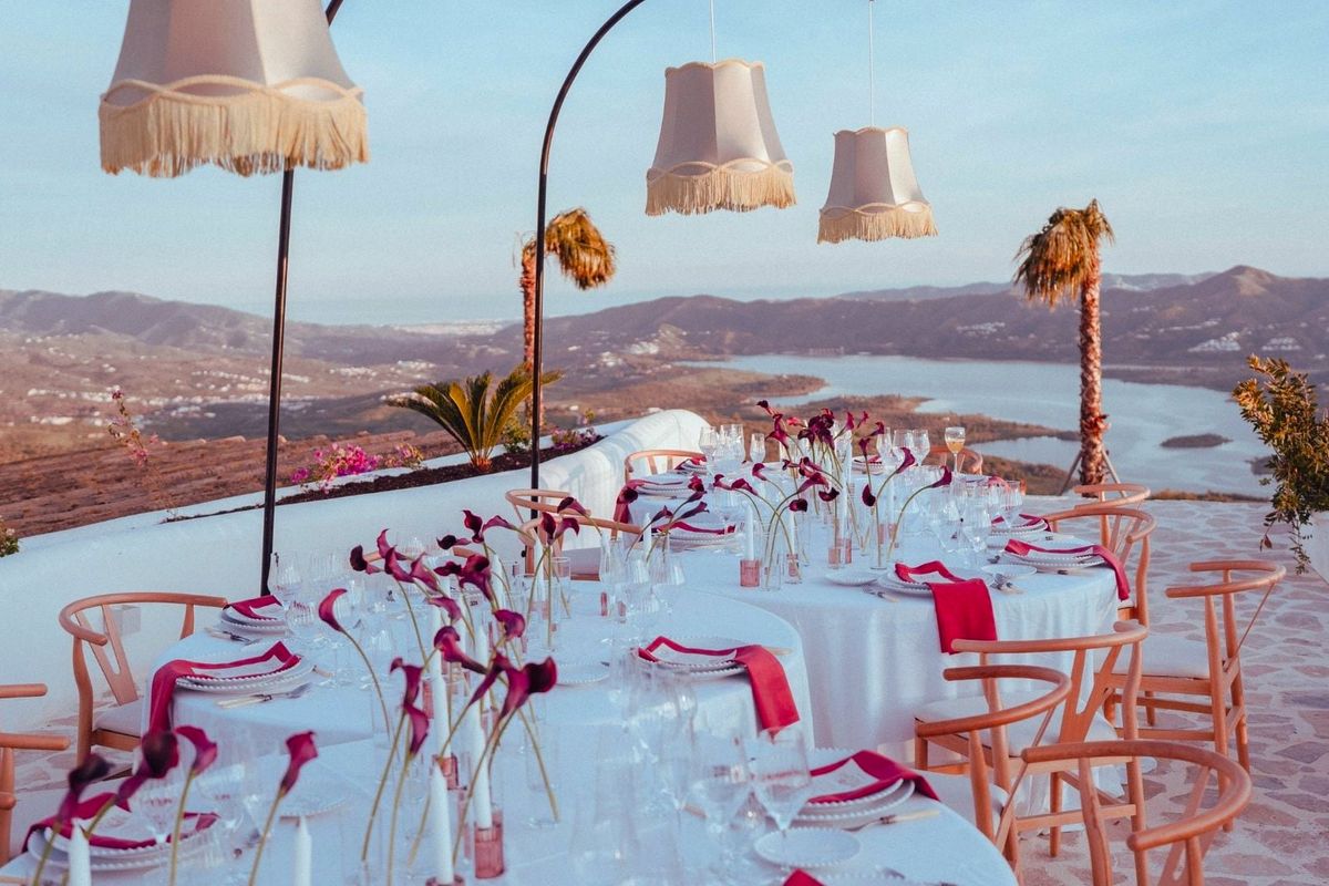 Dinner table set at sunset on the terrace, overlooking the lake