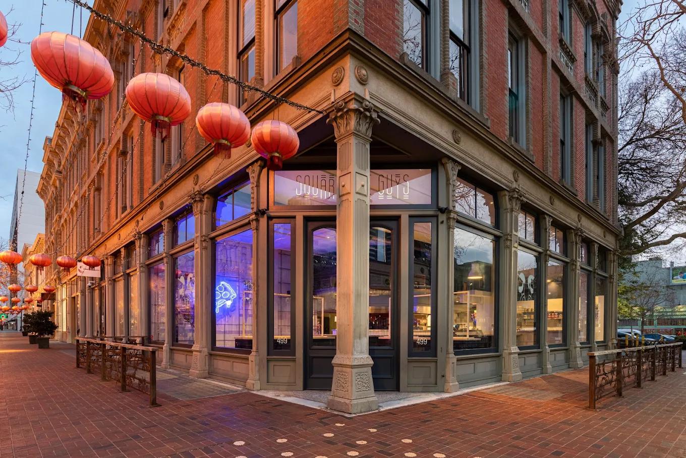 A historic building leading to the entrance of Square Pie Guys in Old Oakland, CA