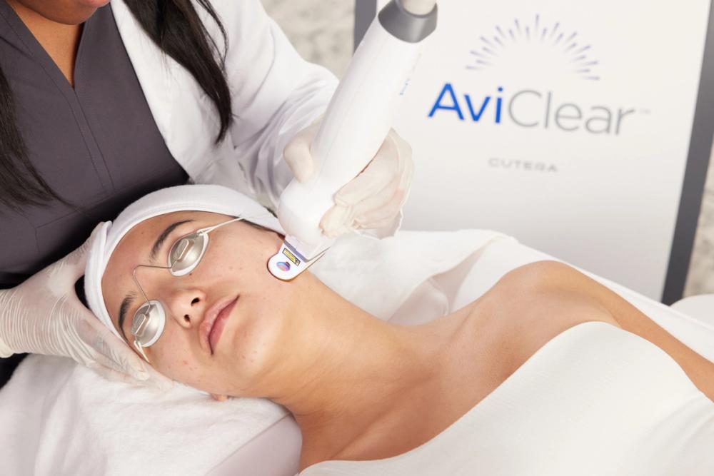 a woman being treated with an aviclear laser