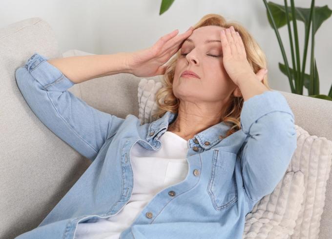 lady holding her head