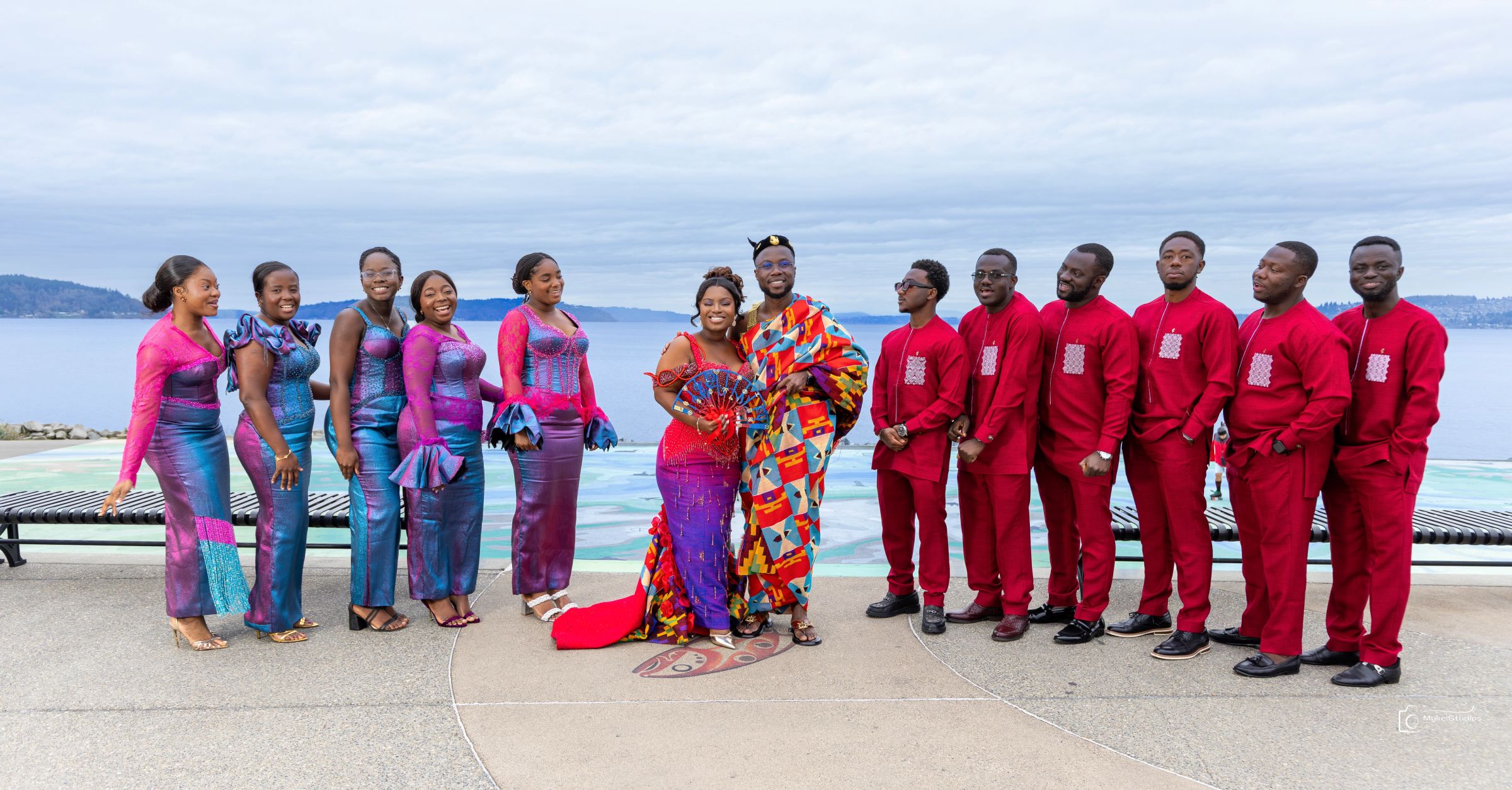 Group photo of a bridal party in traditional attire