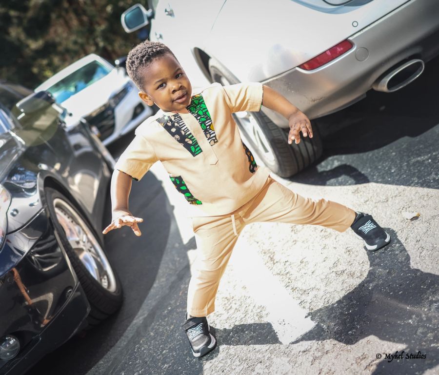 A child infront of cars
