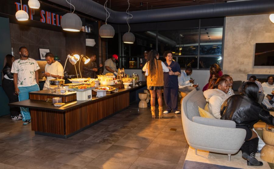 Group of people infront of a buffet table