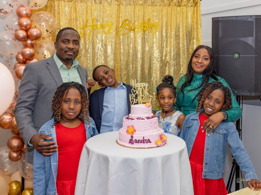 Family around a birthday cake