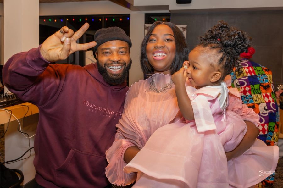 Family smiling with child
