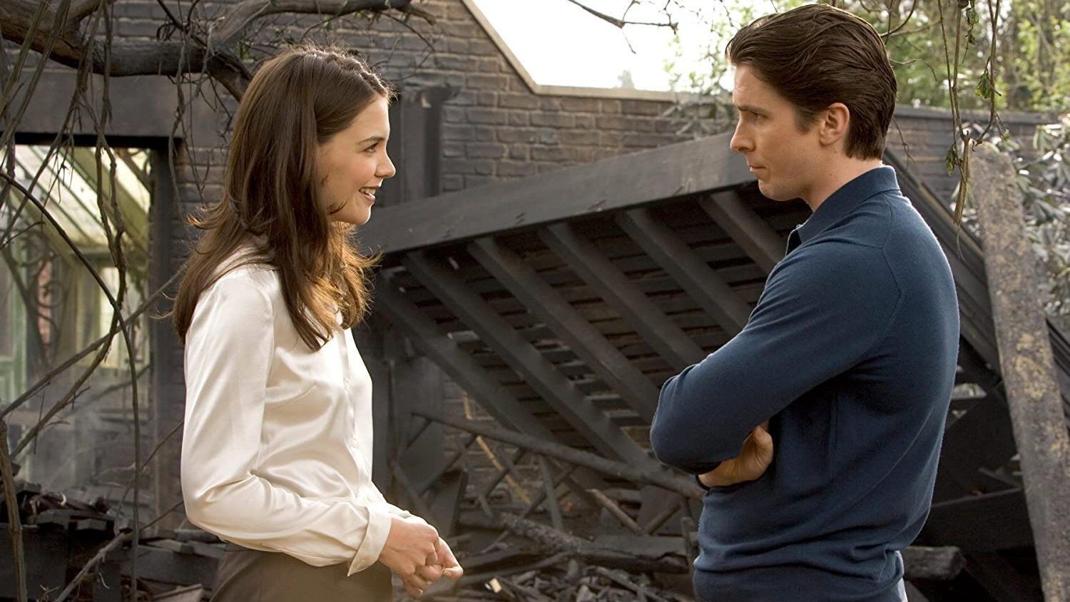 Christian Bale and Katie Holmes in a daylight scene from Batman Begins